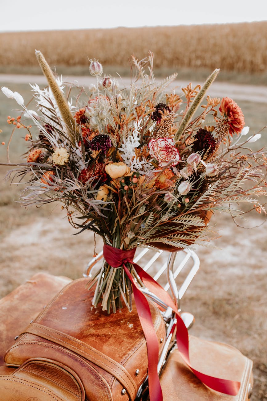 An imperfect, beautiful wedding table setting with wildflowers and handwritten cards