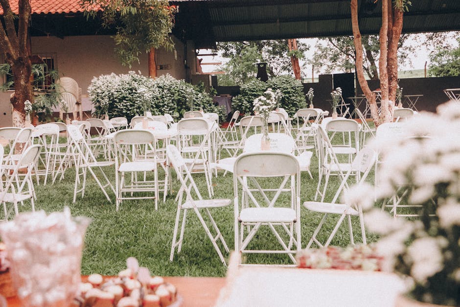 A forest clearing with sunlight filtering through tall trees, set for an intimate wedding ceremony